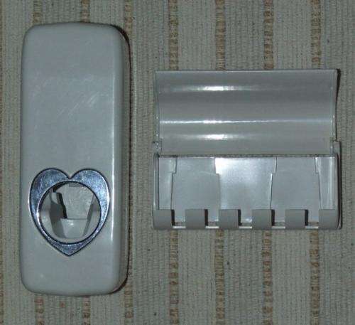 Toothpaste dispenser with toothbrush holder.No more mess